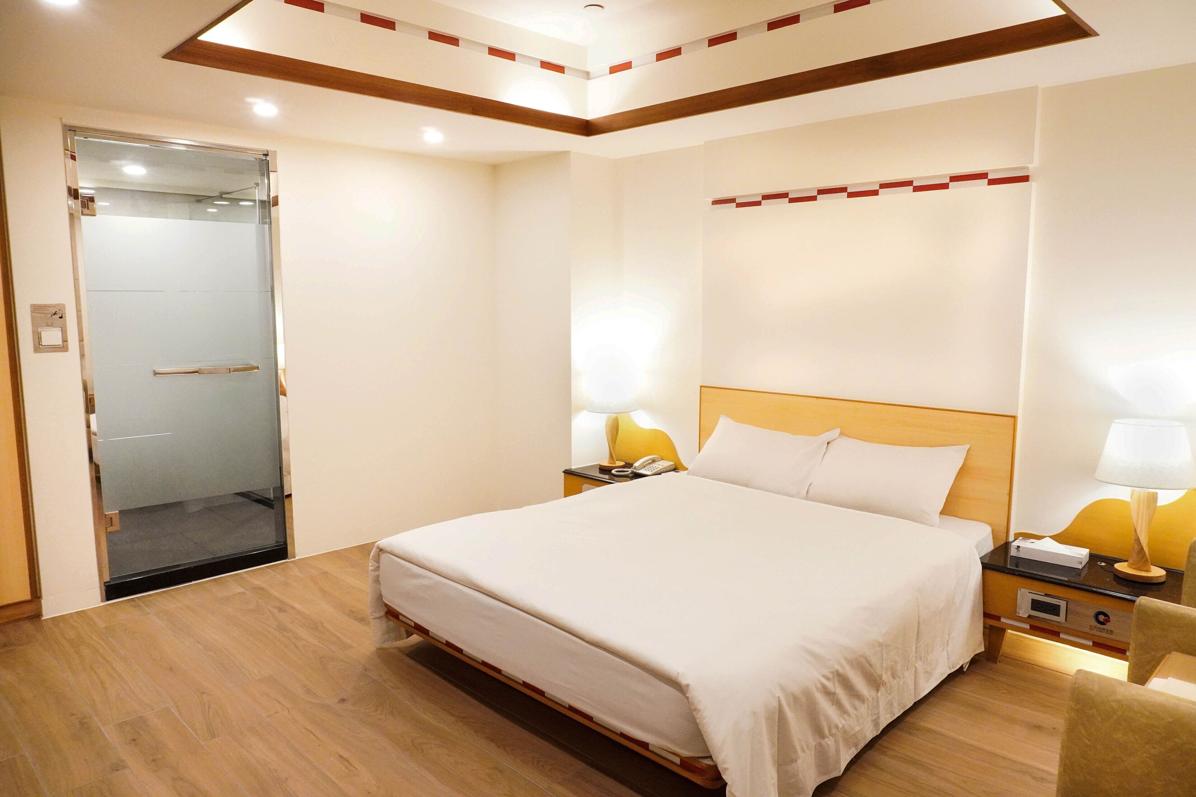deluxe suite (no room cleaning service) | desk, blackout curtains, free wifi, bed sheets
