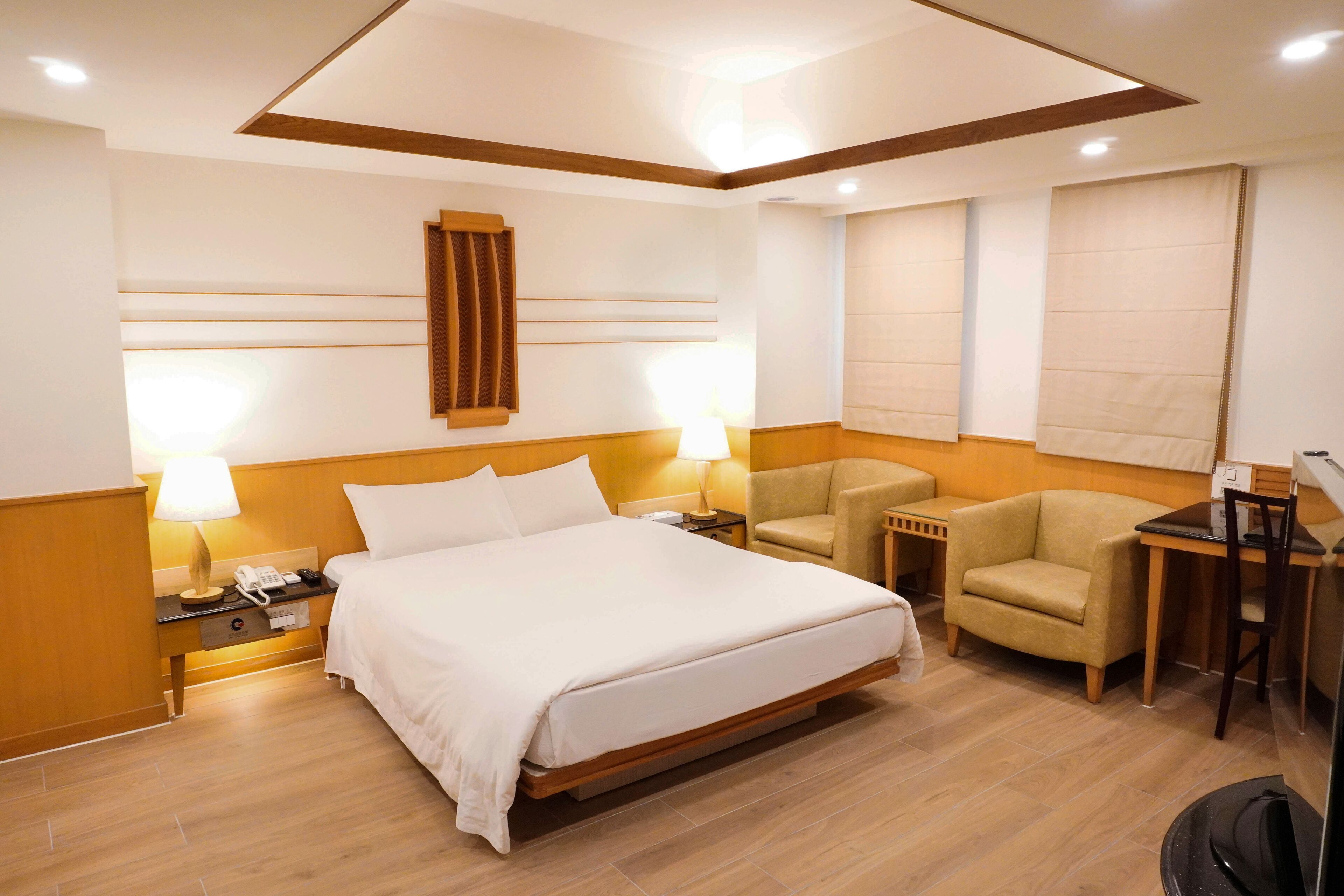 deluxe suite (no room cleaning service) | desk, blackout curtains, free wifi, bed sheets