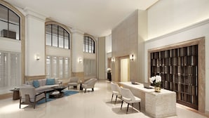 A spacious lobby with a reception desk, seating area, and large windows. - Marriott Executive Apartments Bangkok, Sukhumvit 50 (Bangkok)