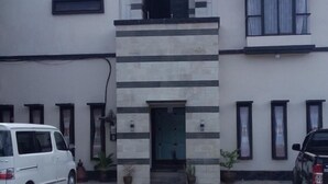 A building with a sign reading "Jaya Phita Guest House". - Jaya Phita Guest House (Kupang)