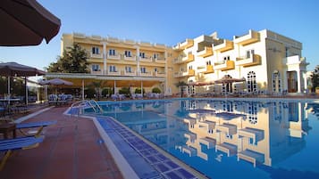 Seasonal outdoor pool, pool umbrellas, pool loungers