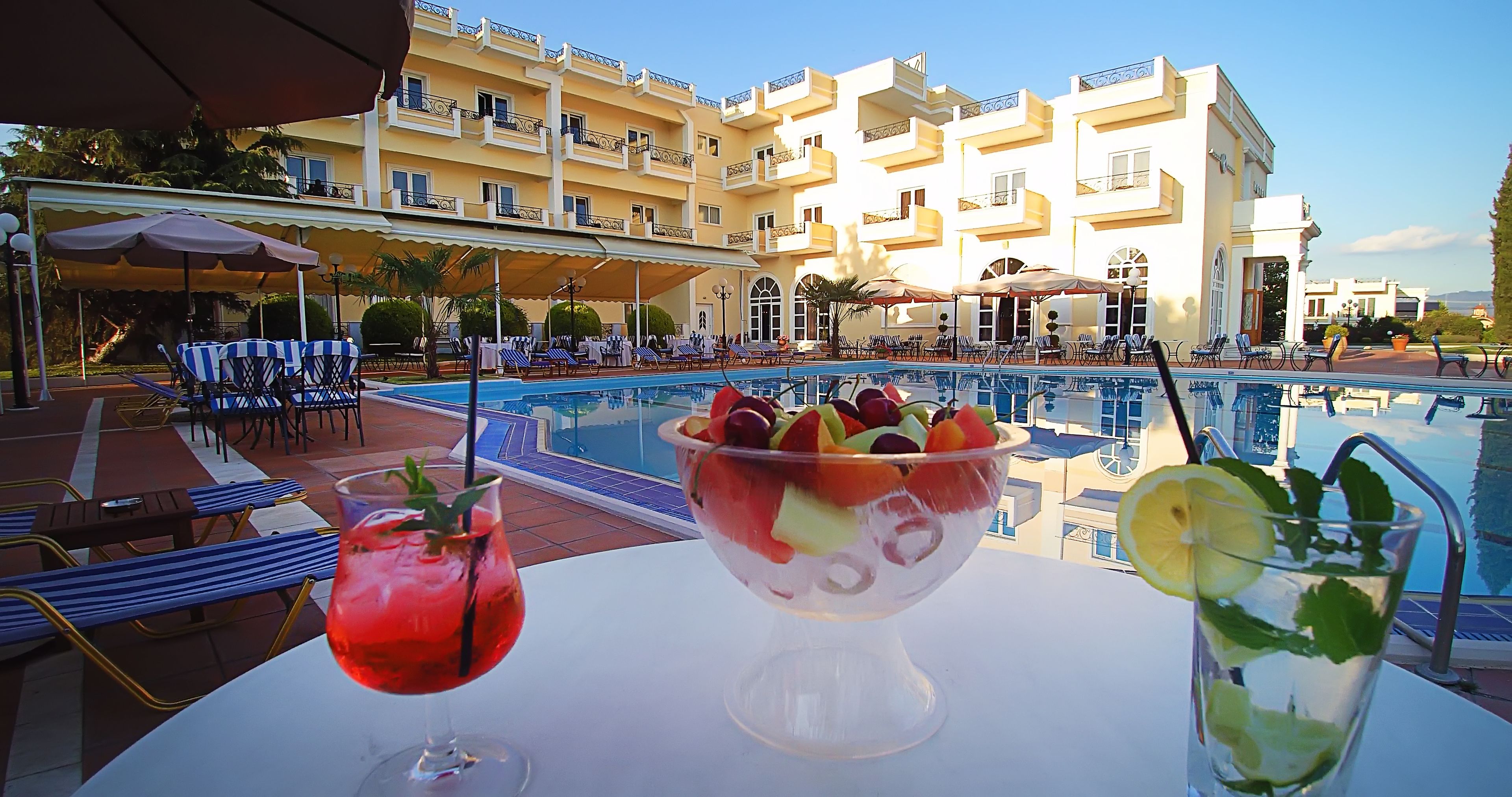 seasonal outdoor pool, pool umbrellas, pool loungers