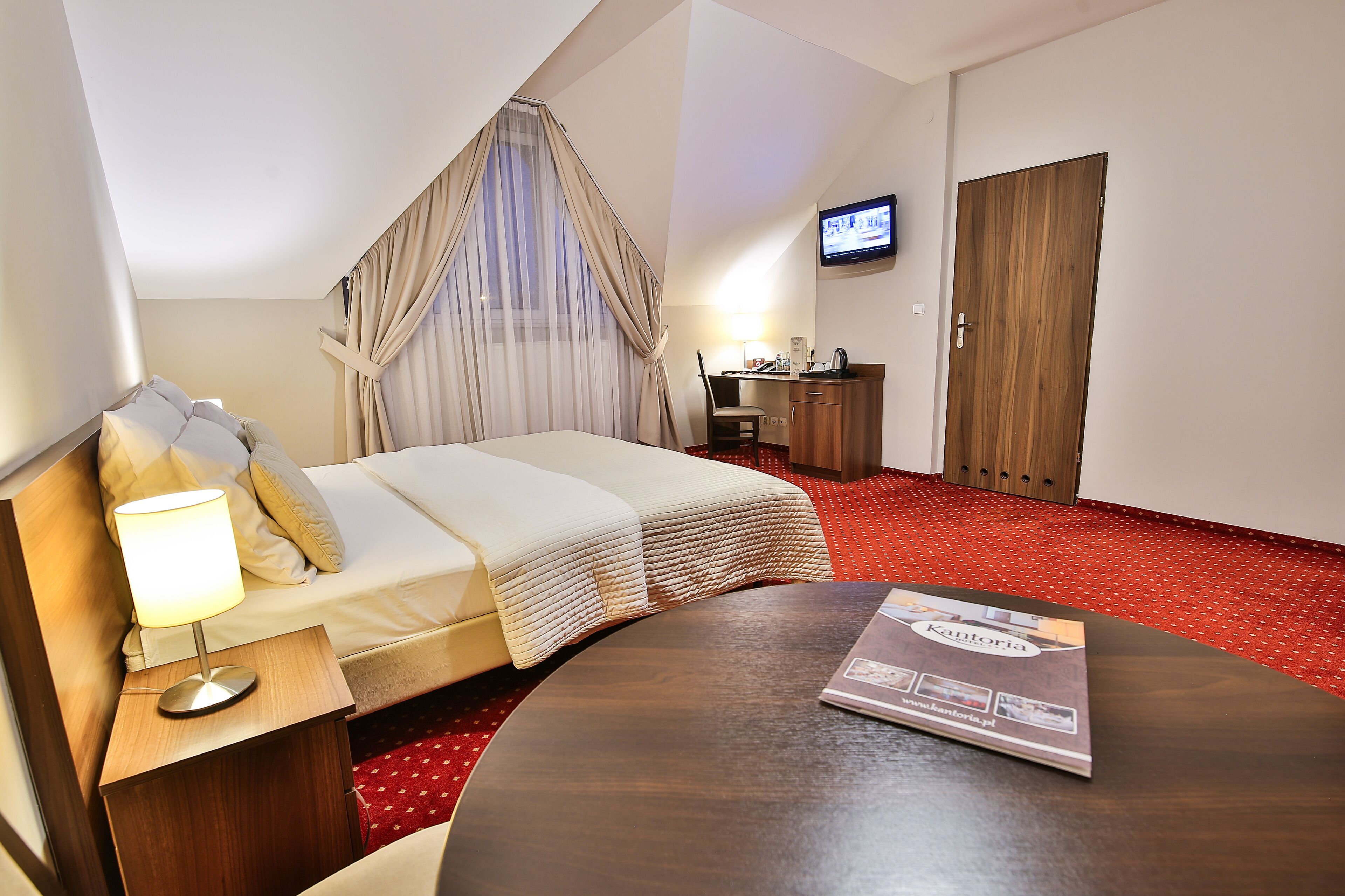 comfort double room | living area | flat-screen tv