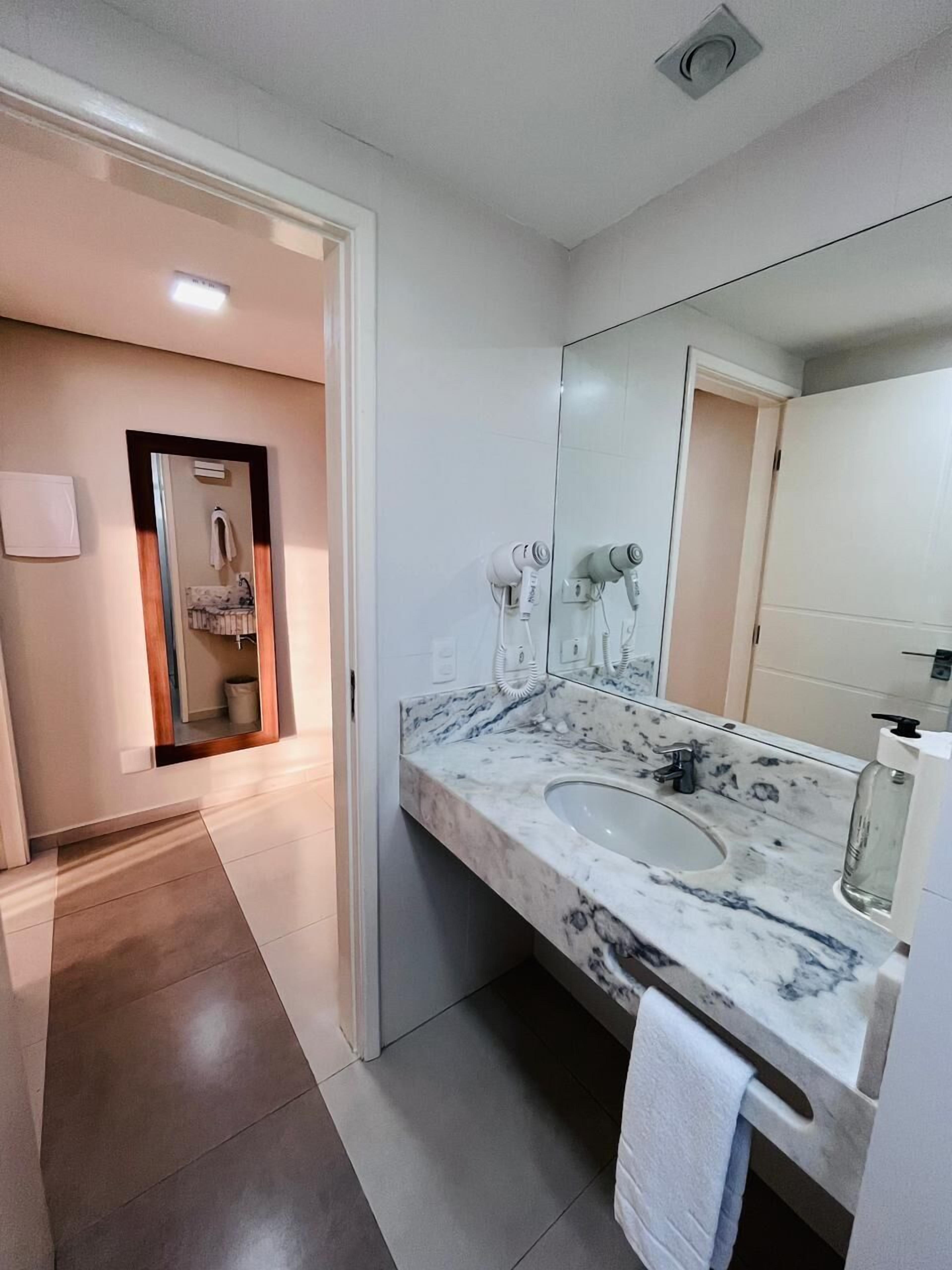 superior quadruple room | bathroom | shower, free toiletries, hair dryer, towels