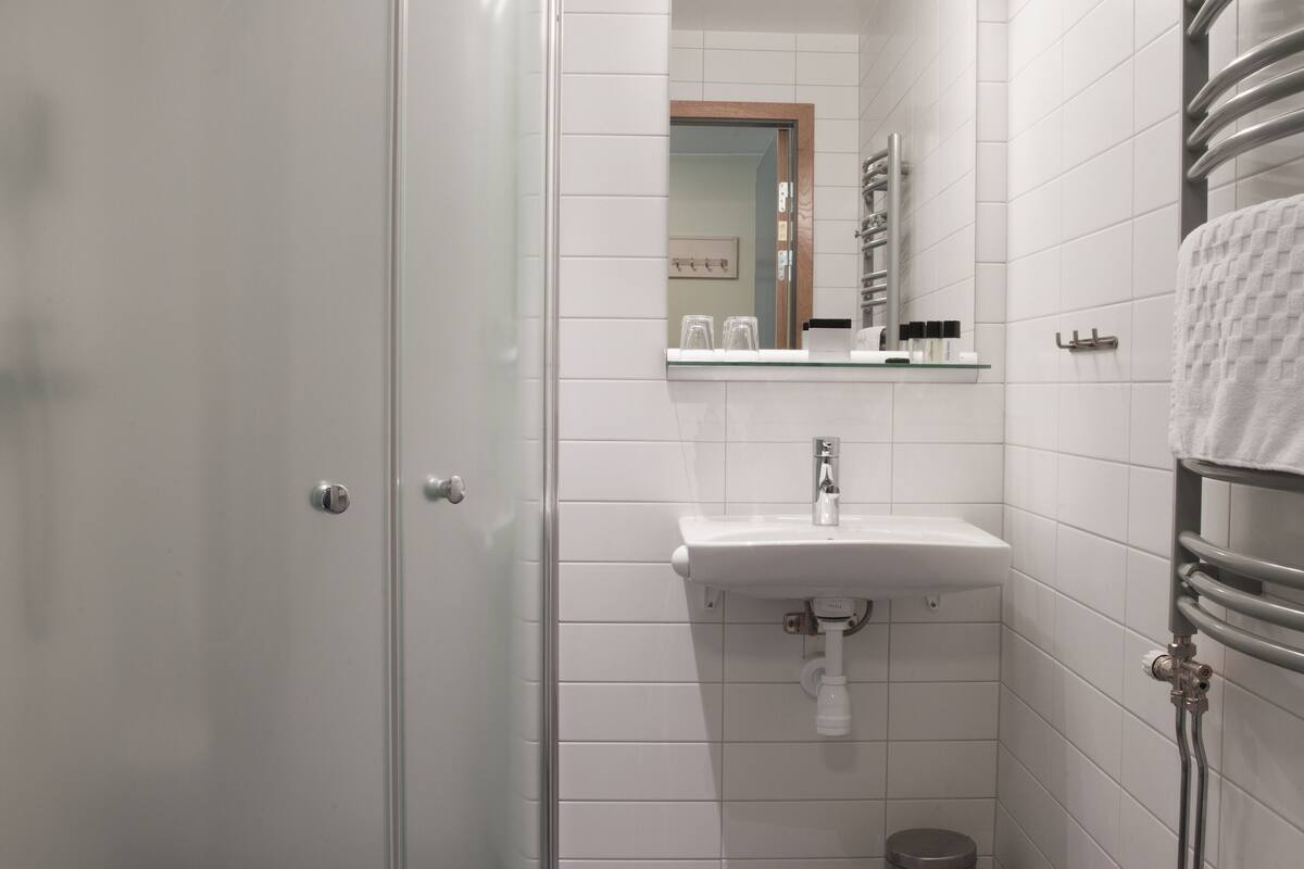 shower, hair dryer, heated floors, towels