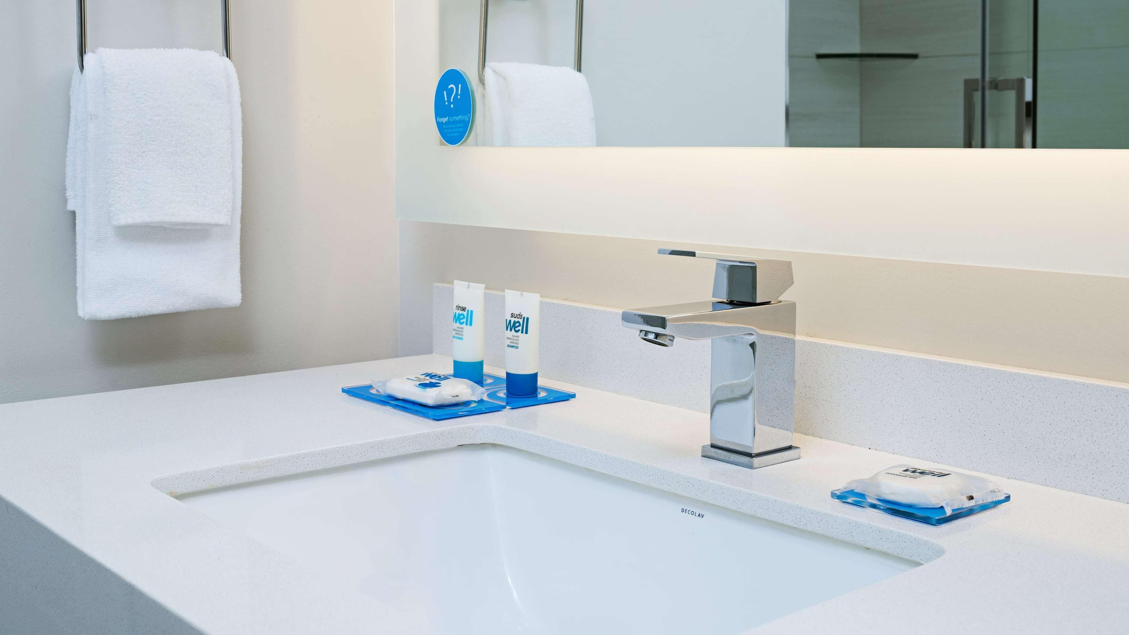 eco-friendly toiletries, hair dryer, towels