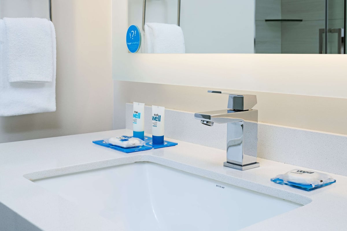 eco-friendly toiletries, hair dryer, towels