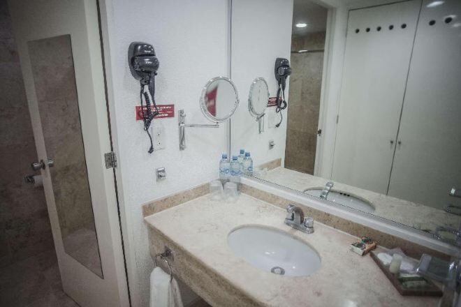 Bathroom | Shower, designer toiletries, hair dryer, towels