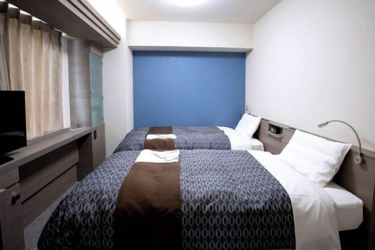 Blackout drapes, iron/ironing board, free WiFi, bed sheets
