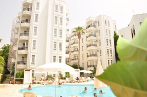 Outdoor pool, pool umbrellas, sun loungers