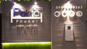 A sign for Pakto room service with amenities icons for WiFi, snowflake, golf, and TV. - Pakta Phuket (Phuket)