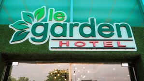 A hotel sign with the name "le garden HOTEL" and a decorative leaf design. - Le Garden Hotel (Shah Alam)