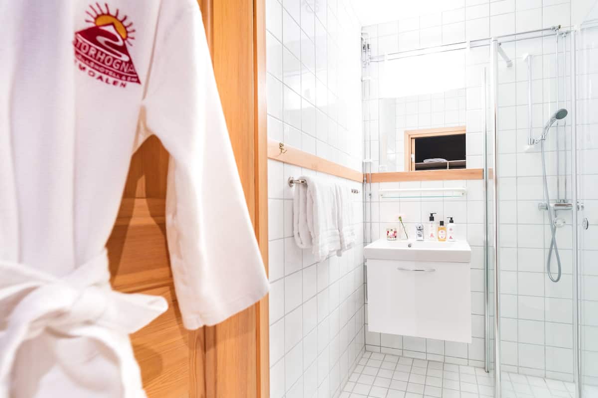 shower, hair dryer, bathrobes, slippers