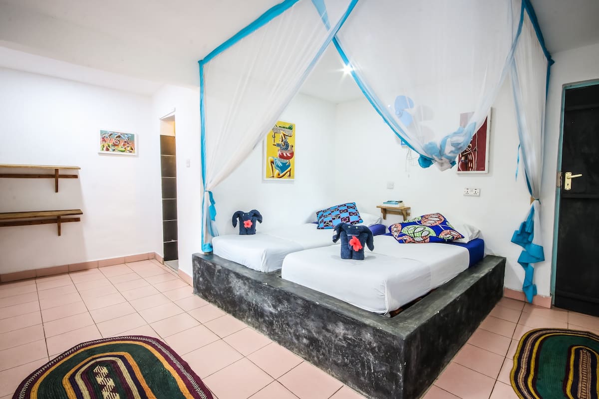 Bungalow familiare, camere multiple, vista oceano parziale | 1 camera, lenzuola