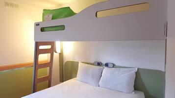 A bunk bed with a green top bunk and white bedding.