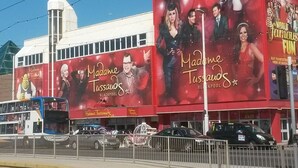 A building with large advertisements for 'Madame Tussauds' and 'Blackpool'. - Nelcon Hotel (Blackpool)