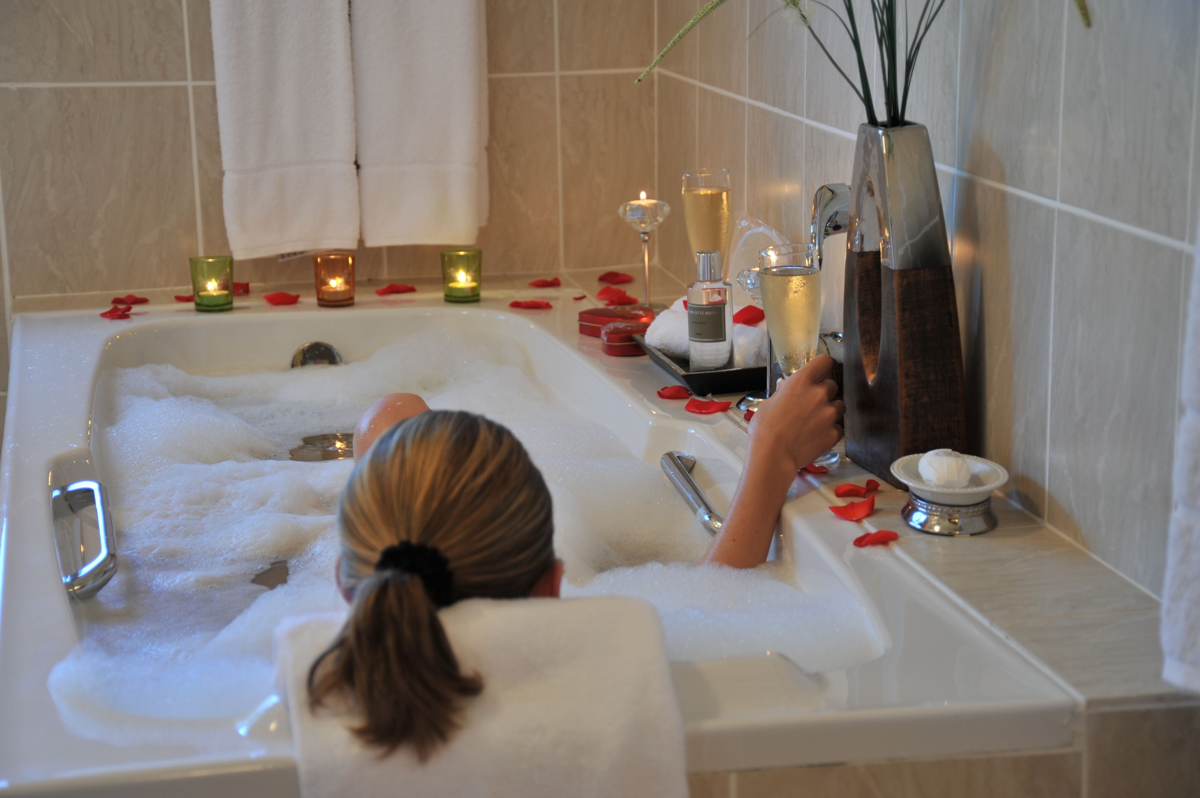 shower, designer toiletries, hair dryer, towels