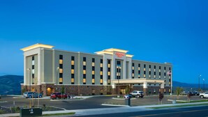 A large, modern hotel with a flat roof and a prominent entrance.