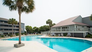 A swimming pool with lounge chairs and a lifeguard stand. - MARINERS CAY 45 2 Bedroom Holiday Home By My Ocean Rentals (Folly Beach)