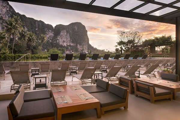 Breakfast, lunch served; local and international cuisine, pool views