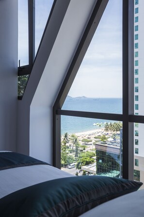 Deluxe Triple Room, Partial Ocean View | Premium bedding, minibar, in-room safe, desk - Venue Hotel (Nha Trang)