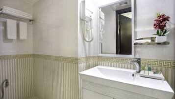 Superior Single Room, 1 King Bed | Bathroom | Combined shower/tub, slippers, towels