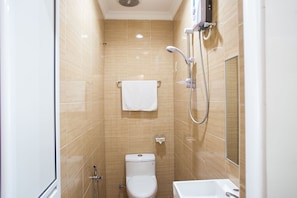 A small, modern bathroom with a toilet, a shower, and a sink. - PJ Park Hotel (Petaling Jaya)