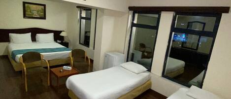Comfort Quadruple Room | Minibar, in-room safe, desk, blackout drapes