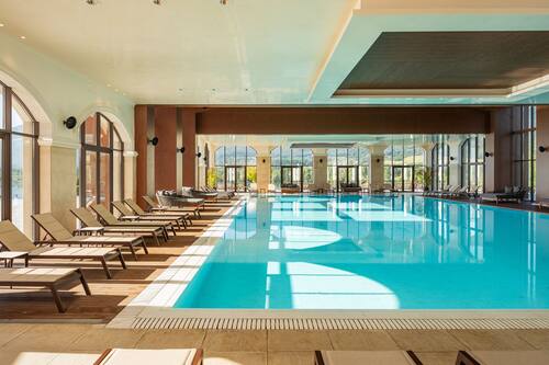 2 indoor pools, open 9:00 AM to 9:00 PM, pool umbrellas, pool loungers
