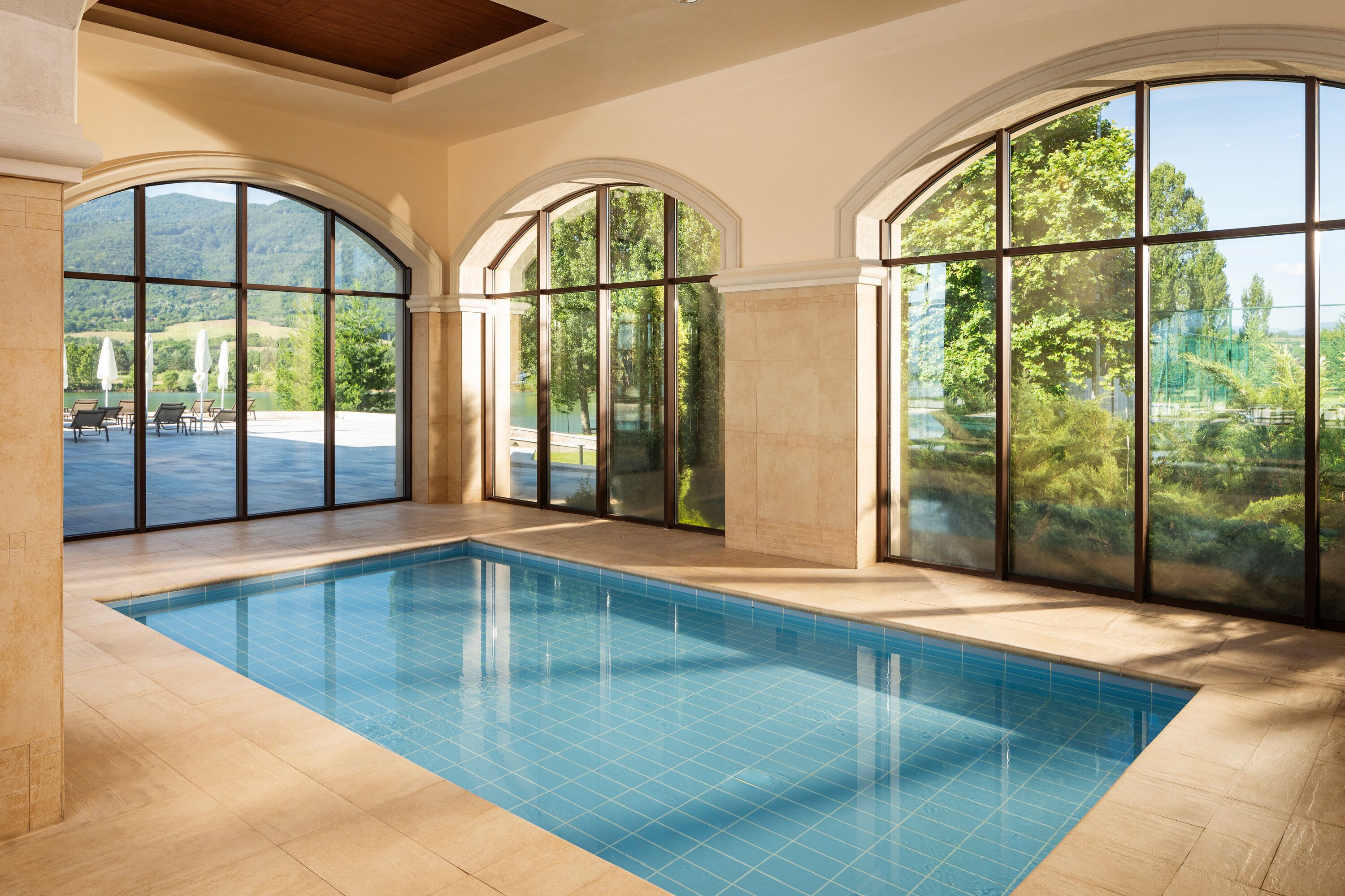 2 indoor pools, open 9:00 AM to 9:00 PM, pool umbrellas, pool loungers