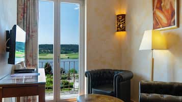 Suite, Lake View | Living area | Flat-screen TV