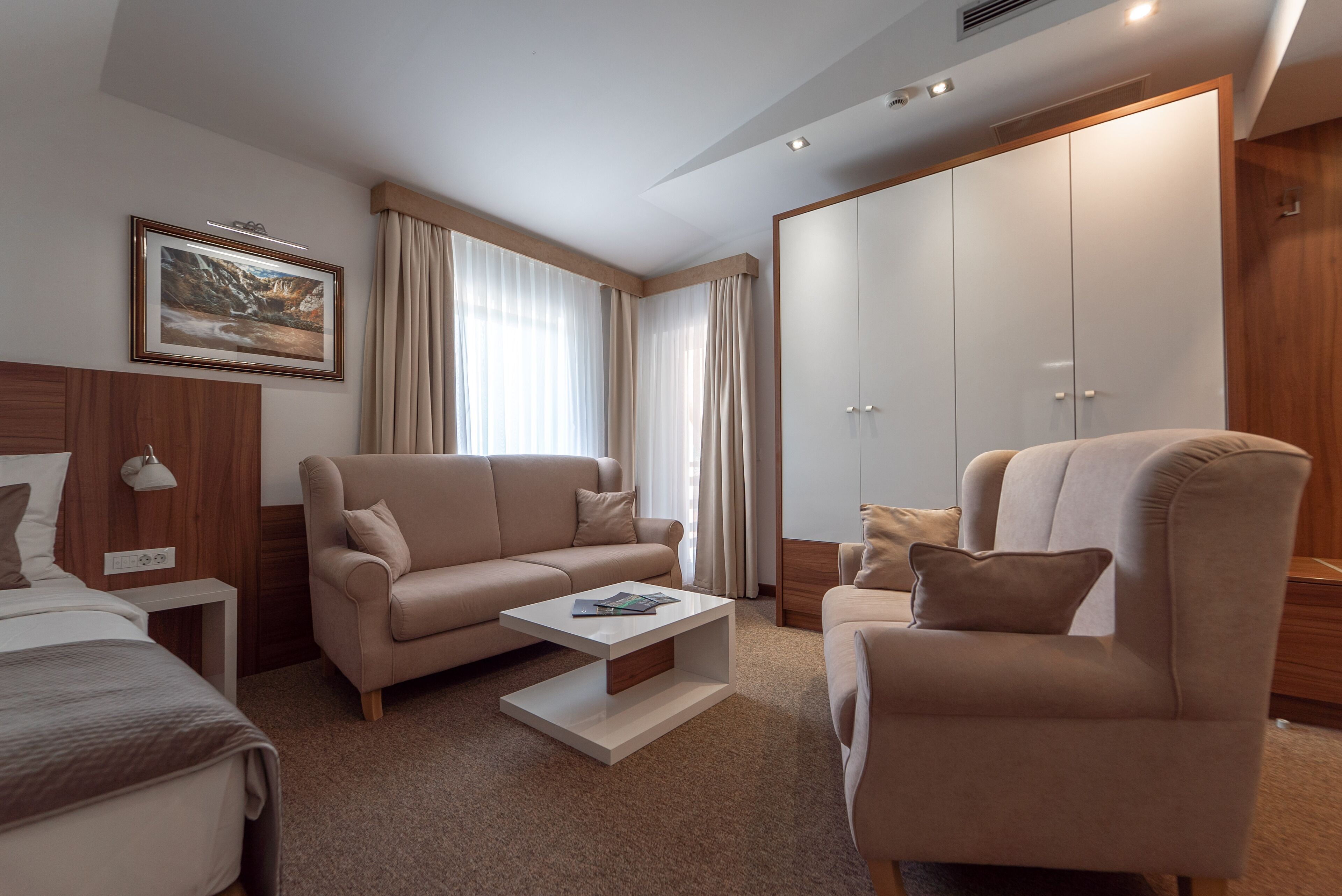 deluxe suite, 2 bedrooms, balcony | living room | flat-screen tv