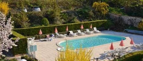 Seasonal outdoor pool, pool umbrellas, pool loungers