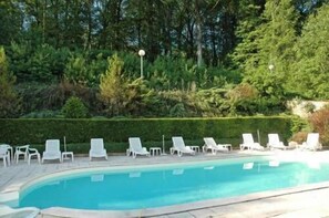 Seasonal outdoor pool, pool umbrellas, pool loungers