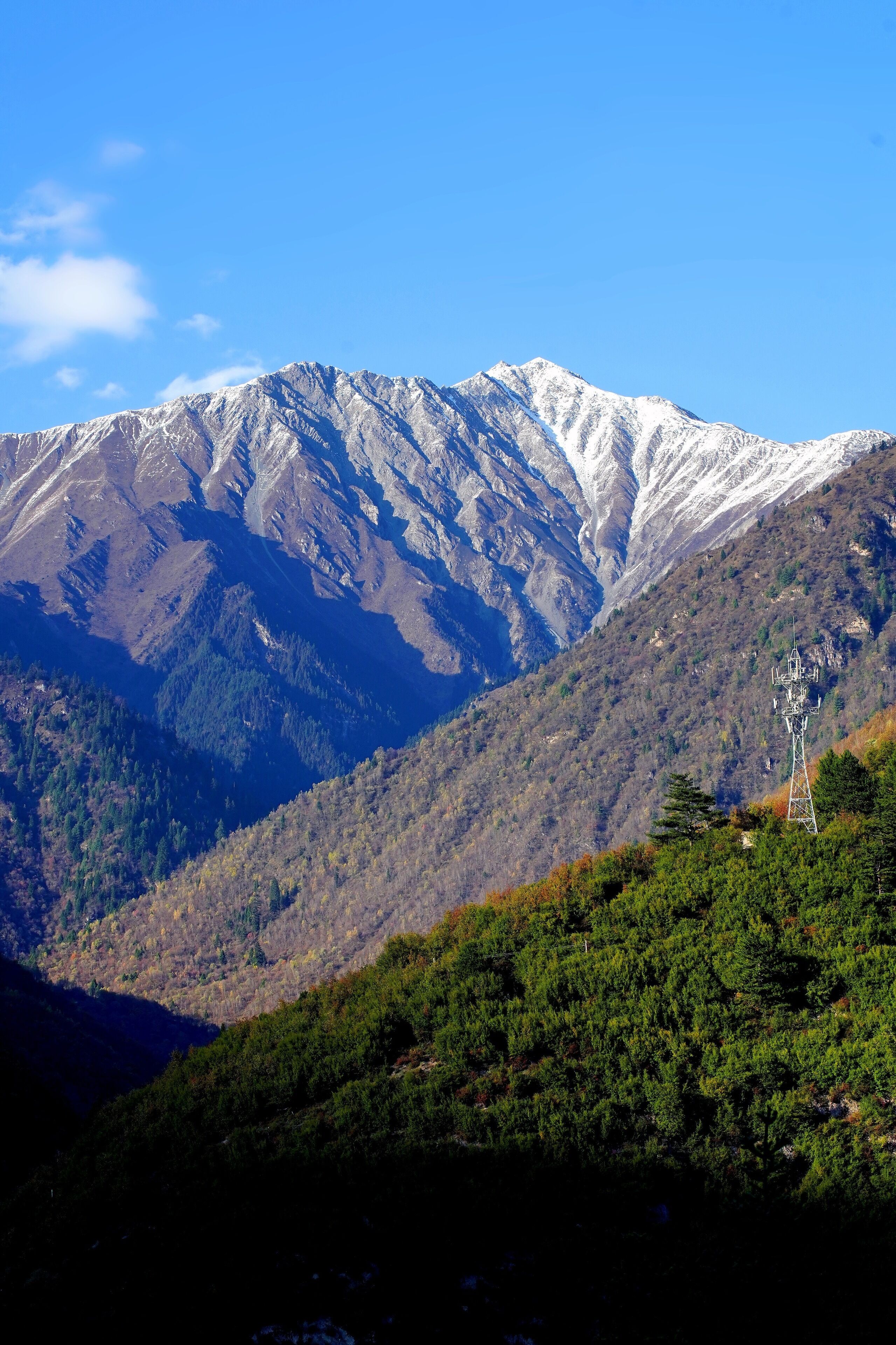 A mountain landscape with a telecommunications tower.