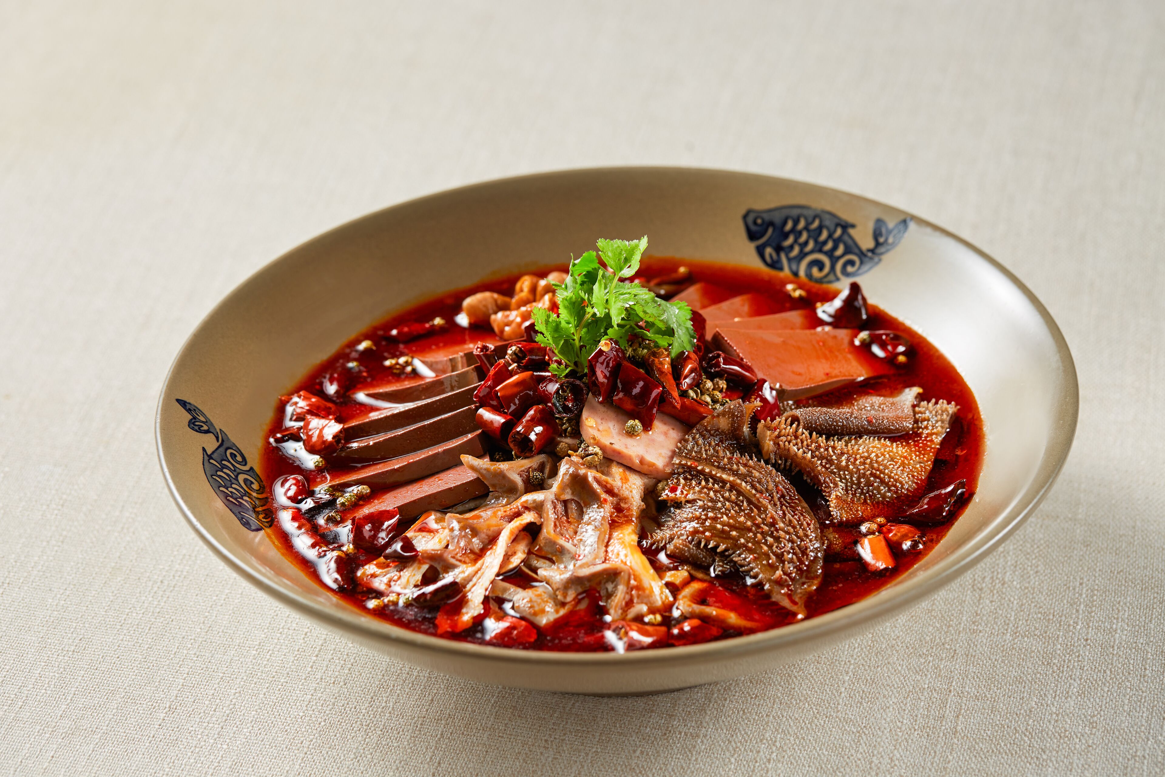 A bowl of soup with various ingredients.