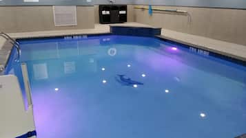 Swimmers can enjoy a safe and well-maintained pool with lane markings and a clear shallow and deep end.