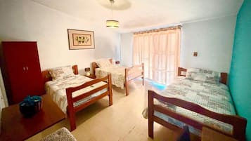 Triple Room, Private Bathroom | Laptop workspace, blackout drapes, free WiFi, bed sheets