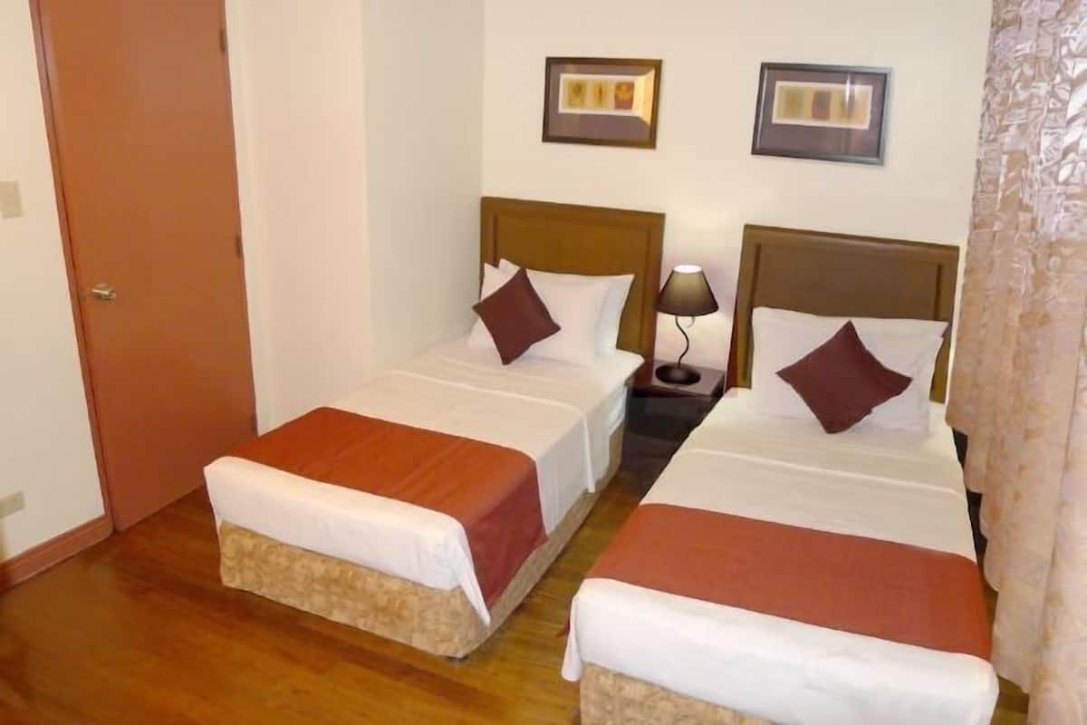Desk, laptop workspace, cots/infant beds, rollaway beds