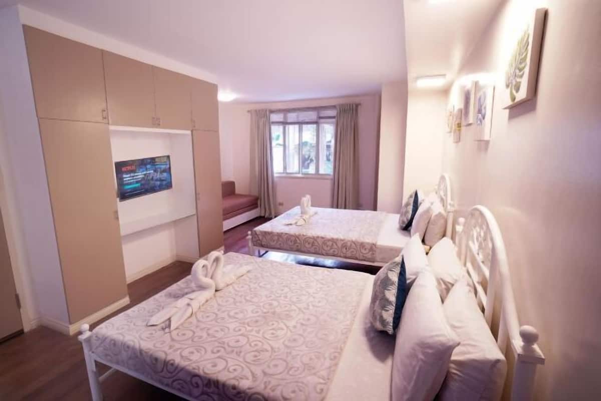Desk, laptop workspace, cots/infant beds, rollaway beds