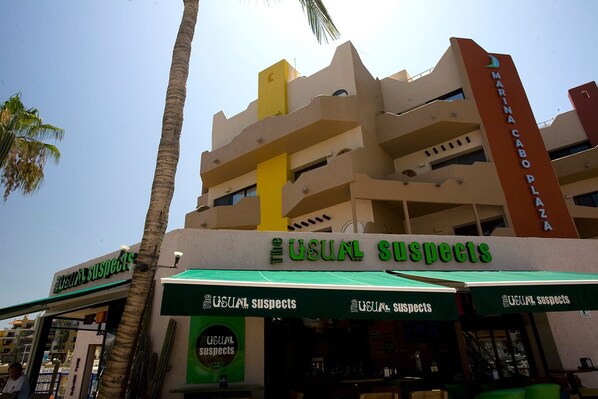 A multi-story building with a sign reading "MARINA CABO PLAZA". - Studio Suite at Marina Cabo Plaza (Cabo San Lucas)