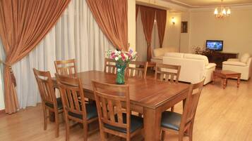 Business Suite, 2 Bedrooms | Living room | Flat-screen TV