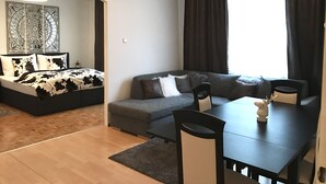 Suite, Mehrere Betten | Wohnzimmer