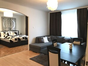 Suite, Multiple Beds | Living room | Flat-screen TV