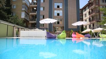Outdoor pool, pool umbrellas, sun loungers