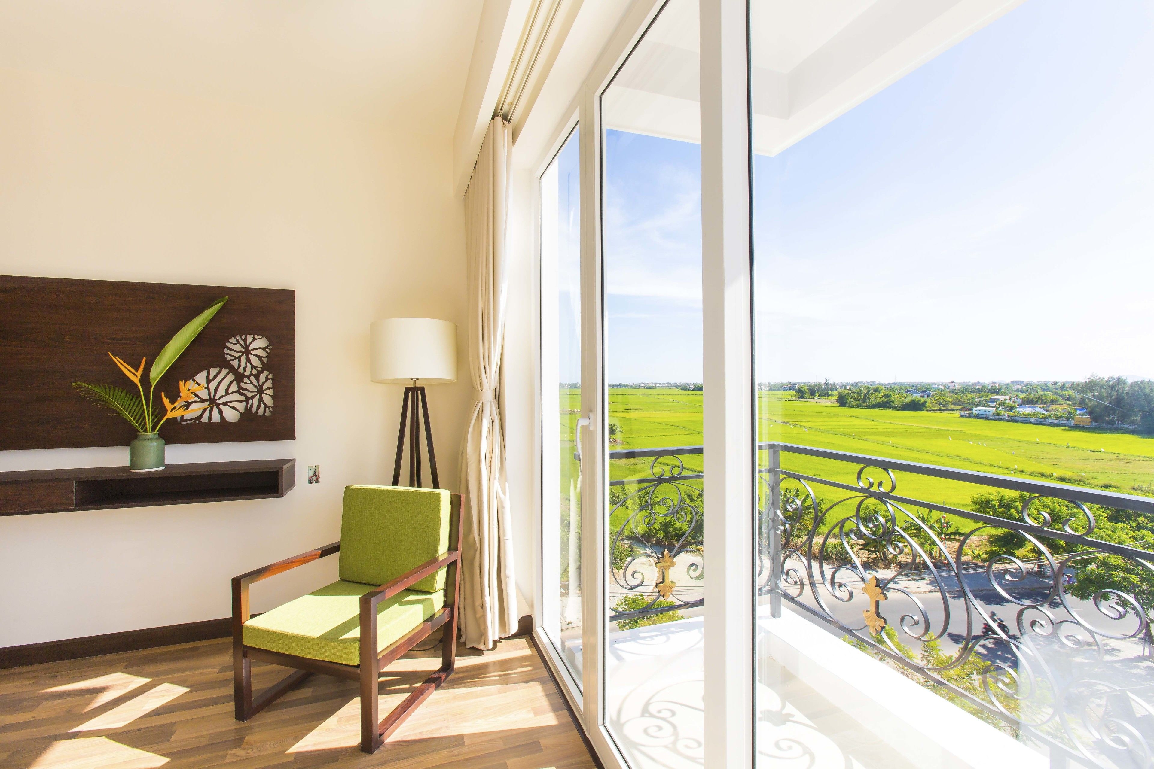 deluxe triple room, balcony (city/rice field view) | view from room