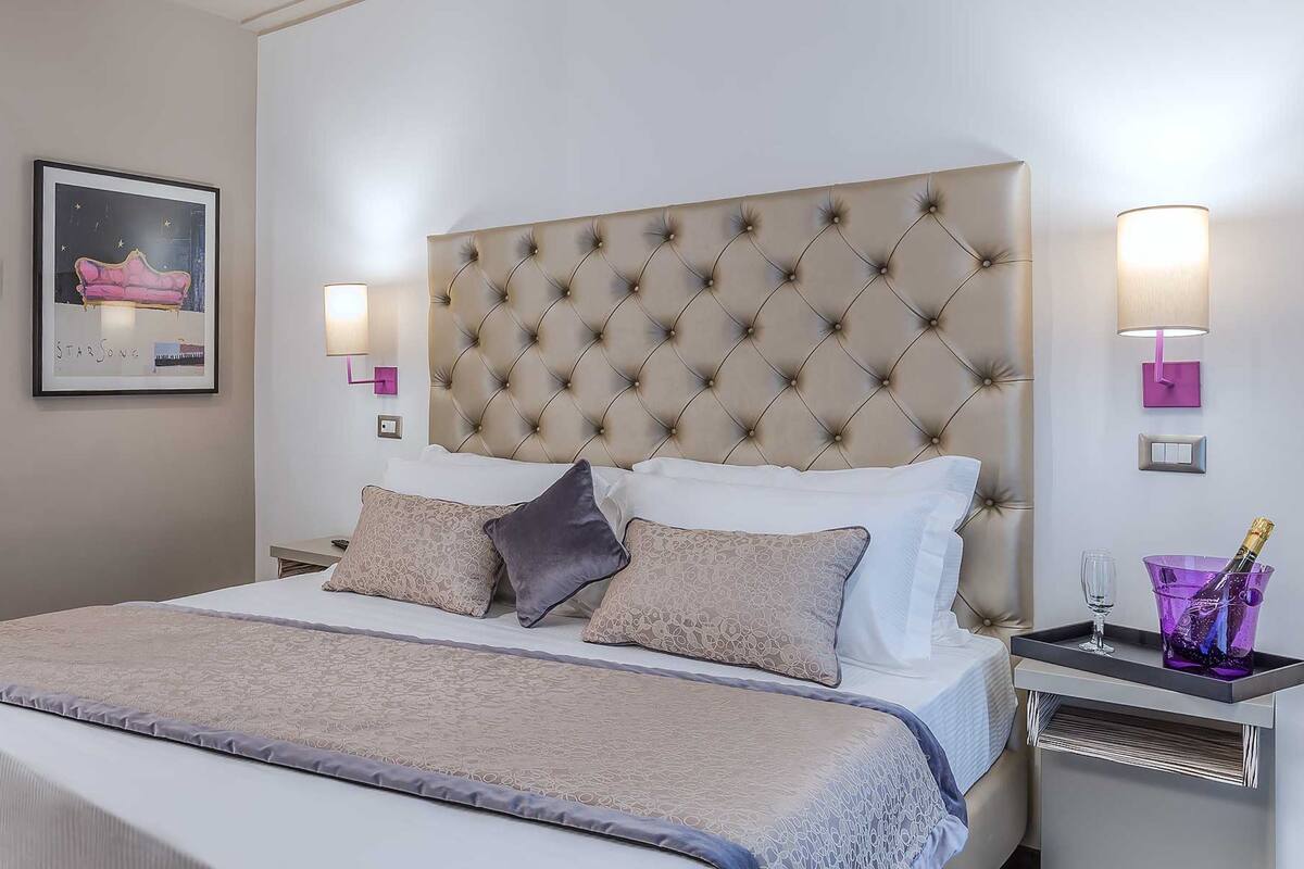 Premium bedding, down comforters, memory foam beds, minibar
