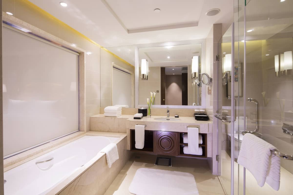 executive suite, 1 king bed | bathroom | separate bathtub and shower, free toiletries, hair dryer, bathrobes
