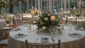A formal dining area with round tables, candles, and floral centerpieces. - Embassy Suites by Hilton Berkeley Heights (Berkeley Heights)