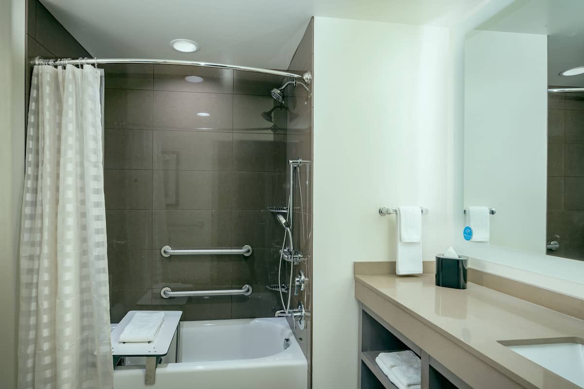 studio, 1 king bed, accessible (with tub) | bathroom | free toiletries, hair dryer, towels